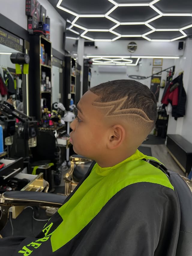 Kids haircut with design at Adelbi's Barbershop, Bronx